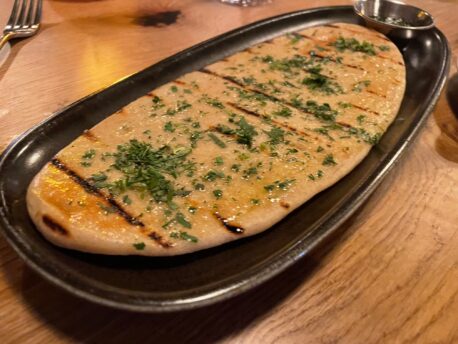 Homemade garlic and herb flatbread at Habas Manchester