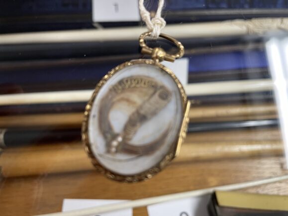 A lock of the composer Mendelssohn's hair entwiined with gold in Manchester's Royal Northern College of Museum (RNCM) Museum of Historic Musical Instruments